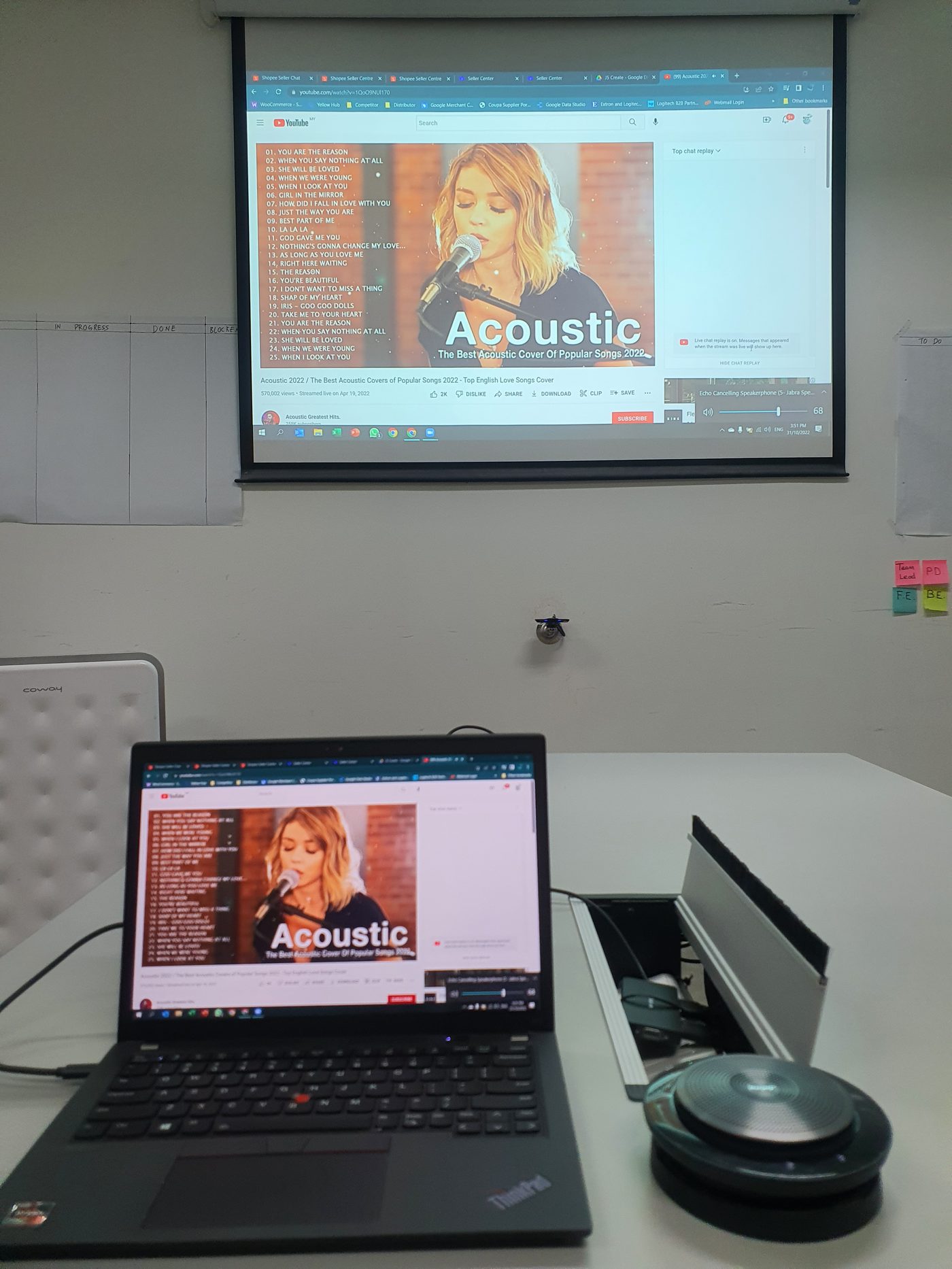 Laptop connected to Jabra speakerphone for huddle room video conferencing setup